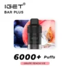 Image of an IGET BAR PLUS POD 6000 PUFFS - Grape Peach Ice vape device featuring 6000 PUFFS in the Grape Peach Ice flavor, with an image of grapes and a peach in the background.