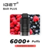 A vaping device labeled "IGET BAR PLUS POD 6000 PUFFS - Raspberry Berry" with a backdrop of raspberries and blueberries. The text indicates the flavor as "Raspberry Berry" and mentions "POD 6000 PUFFS".