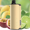 A gold-colored BUNDLE 5 PCS - ALIBARBAR INGOT 9000 vaping device with "Passionfruit Mango Lime" labeled on it is shown in front of a background featuring images of passion fruits, mangos, and lime slices. Get yours today for the ultimate flavor experience.